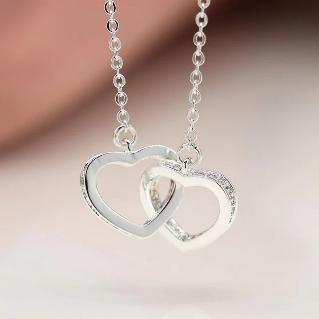 Pom Silver Plated Crystal Edged Linked Hearts