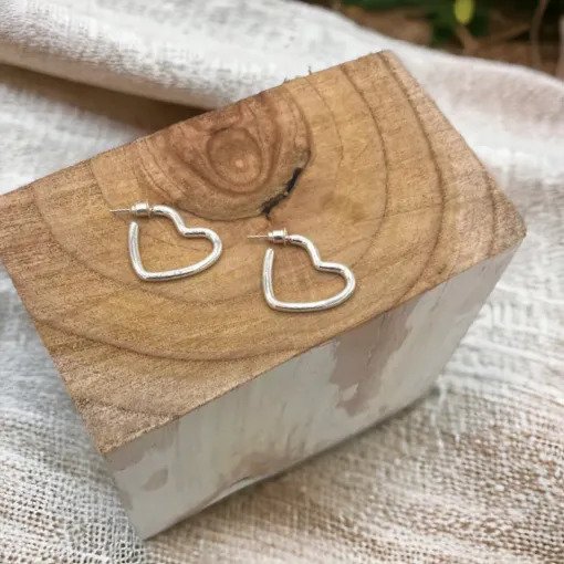 Jess & Lou Hollow Heart Stud Earrings in Silver